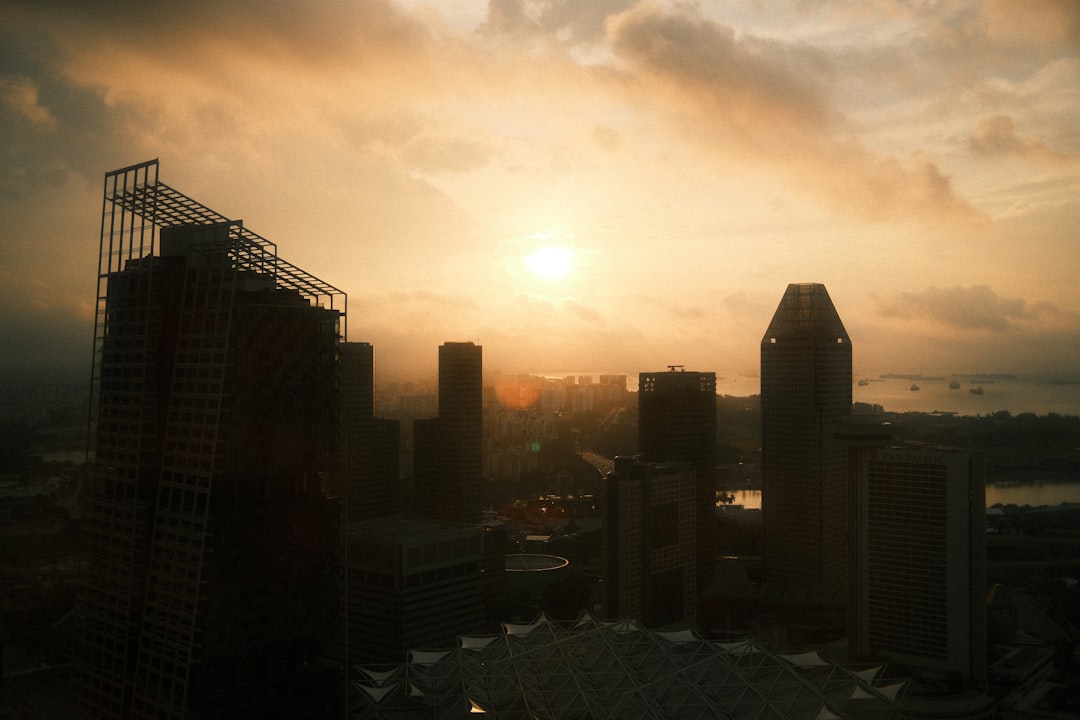 City skyline at sunrise with dramatic clouds